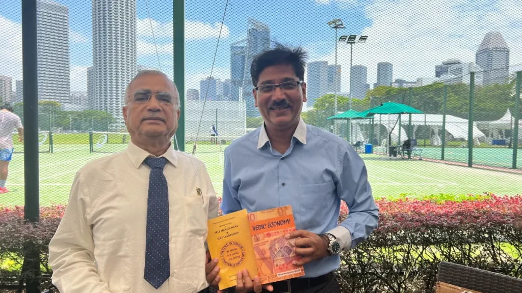 Presenting the Books “Vedic Economy” and “Self- management and Self Leadership” to Mr. Maneesh Tripathi, CEO/Director Marble Rocks VCC Fund Singapore at Singapore Cricket Club